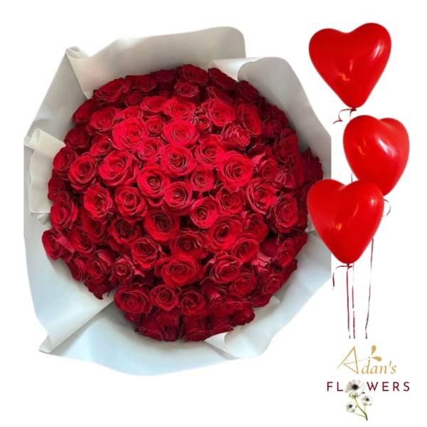Large bouquet of red roses wrapped in white paper with red heart balloons