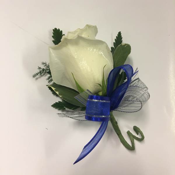 White rose boutonniere with blue ribbon and greenery