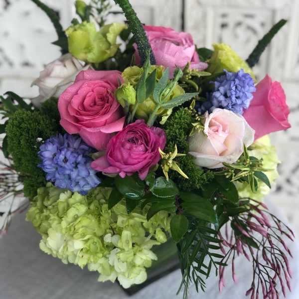 Bouquet of pink, white, green, and blue flowers