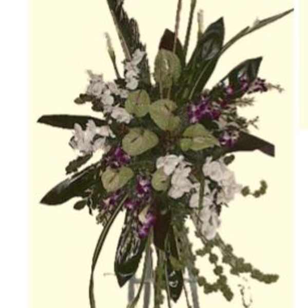 Tall floral arrangement with white and purple blooms