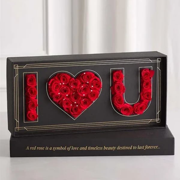 Black display box with red roses arranged as I love you