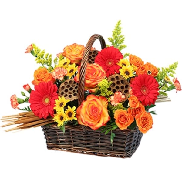 Basket arrangement of orange and red flowers with yellow accents
