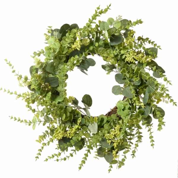 Circular wreath of mixed green foliage on a white background