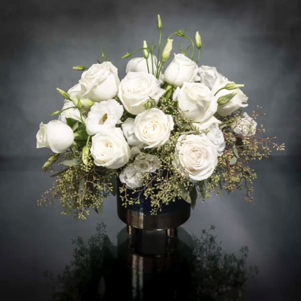 White rose bouquet in a dark vase