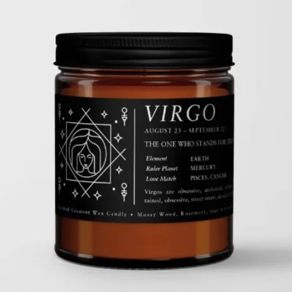 Amber candle in a black-lidded jar with a Virgo label