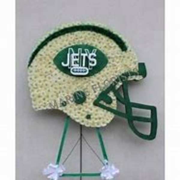 Football-shaped floral tribute on a stand with a Jets logo
