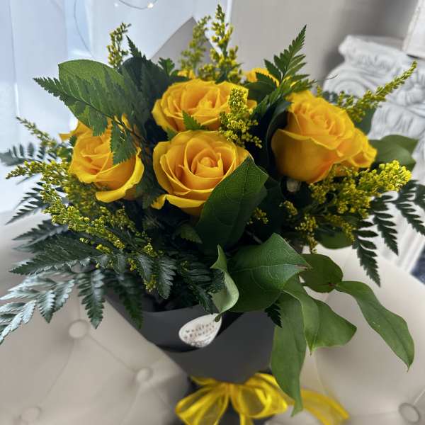 Dozen Yellow Roses wrapped bouquet by Westford Florist Art by Veny