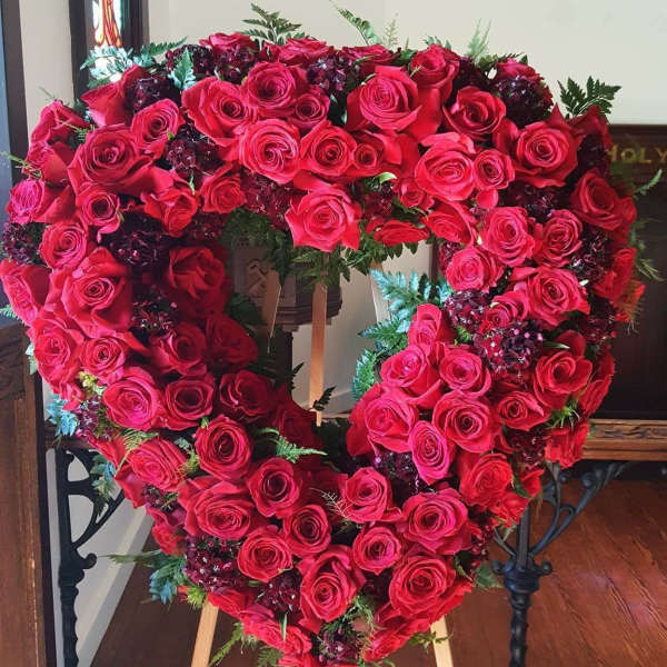 Heart-shaped rose wreath on an easel