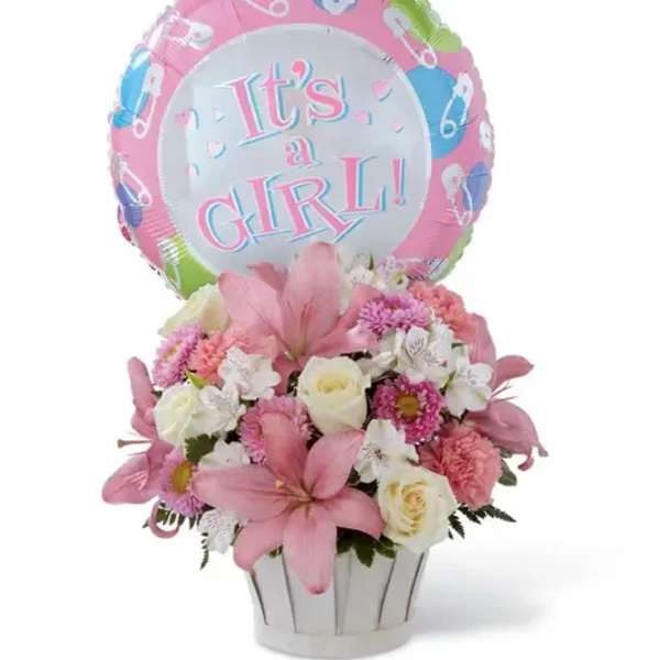 Pink and white flower arrangement in a white pot with an "It’s a Girl" balloon