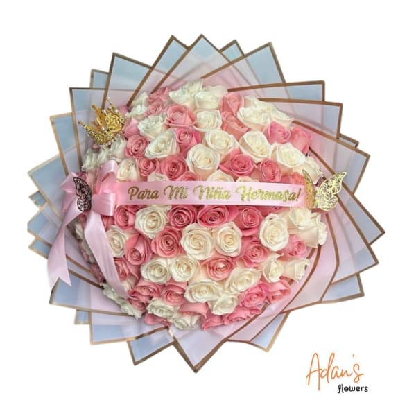 Pink and white rose bouquet with a ribbon and decorative butterflies