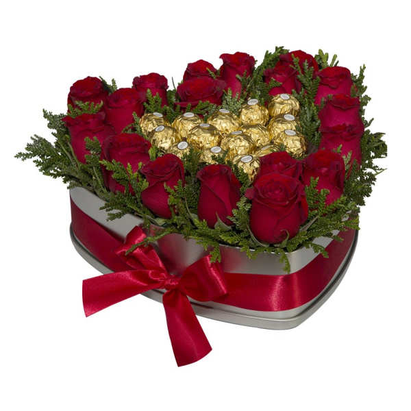 Heart-shaped box of red roses and gold-wrapped chocolates with a red ribbon