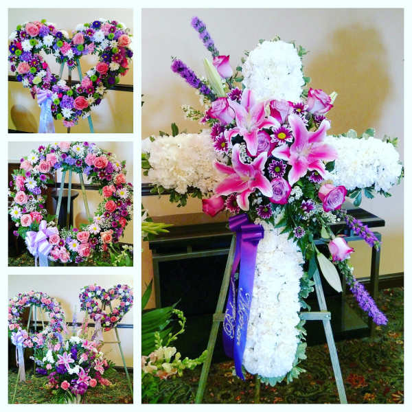Heart-shaped floral wreath on an easel with pink and purple flowers