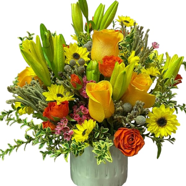 Yellow and orange bouquet with lilies and roses in a ceramic vase
