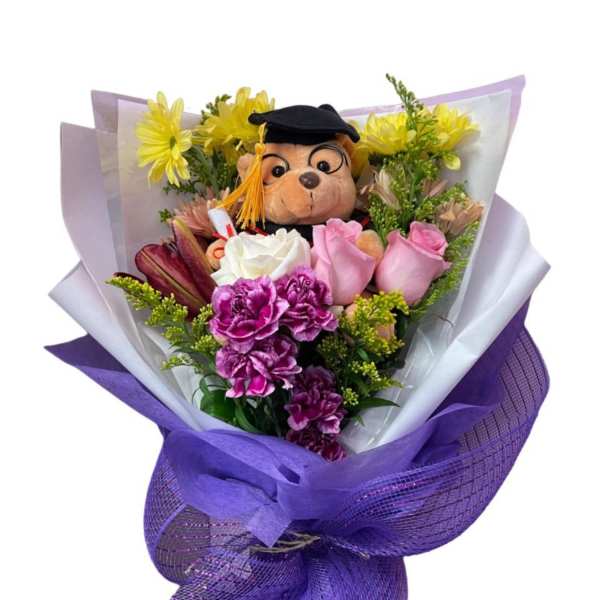 Bouquet with a teddy bear and mixed flowers wrapped in purple paper