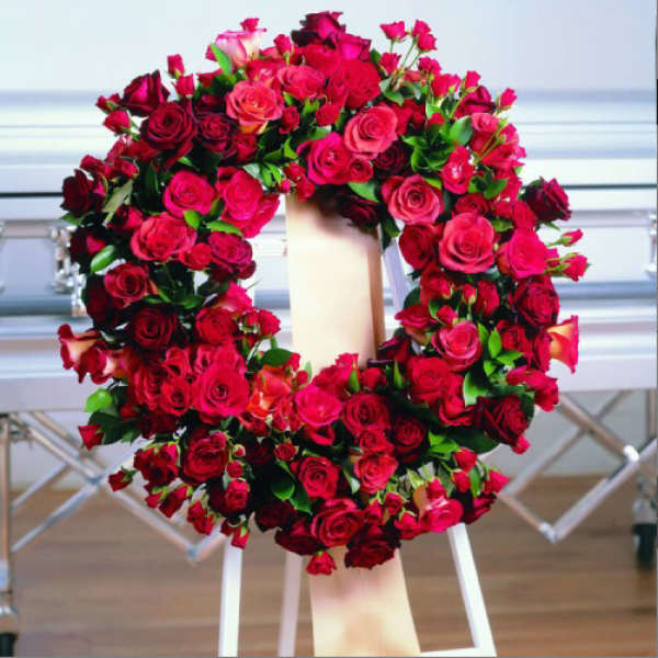 Large red rose wreath on a standing easel