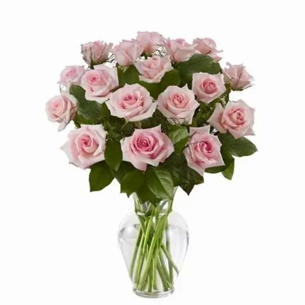 Pink roses arranged in a clear glass vase
