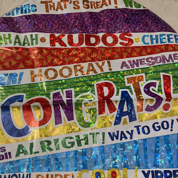 Colorful foil congratulations balloon with large text