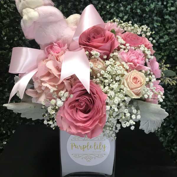 Pink rose bouquet with a plush lamb and satin ribbon in a box