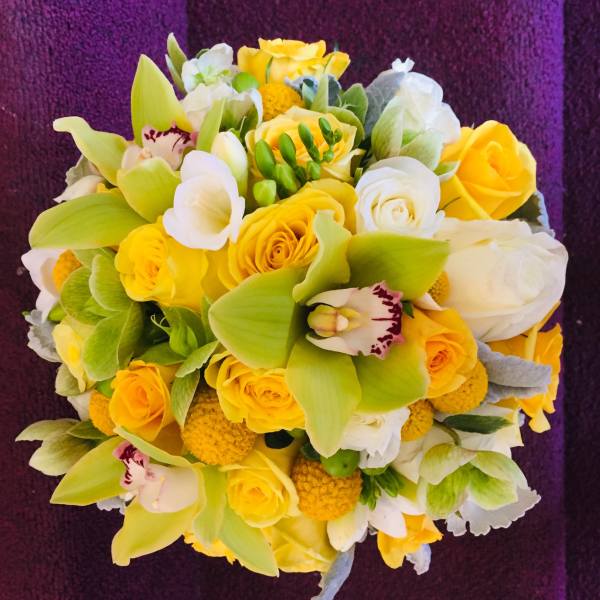 Yellow and white bouquet with orchids and roses