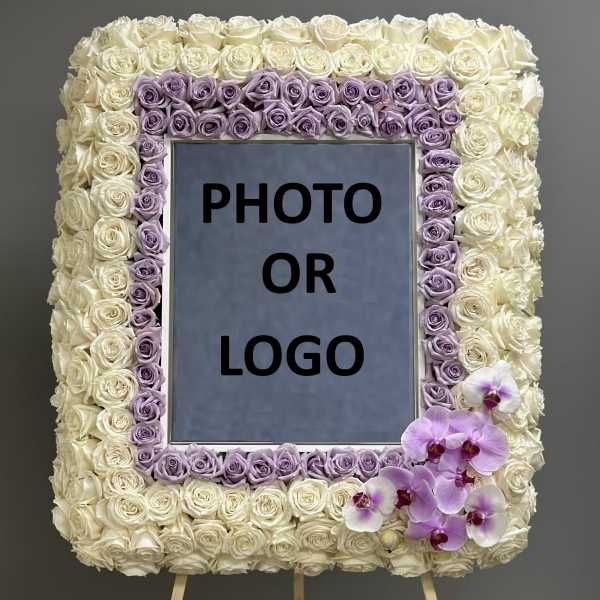 Rose-covered square easel display with a photo or logo center and orchids at the lower right