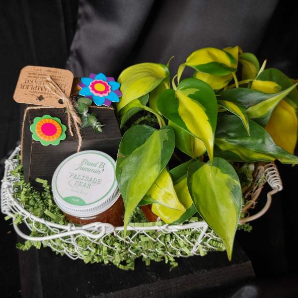 Gift basket with a potted plant, jam jar, and small decorative box