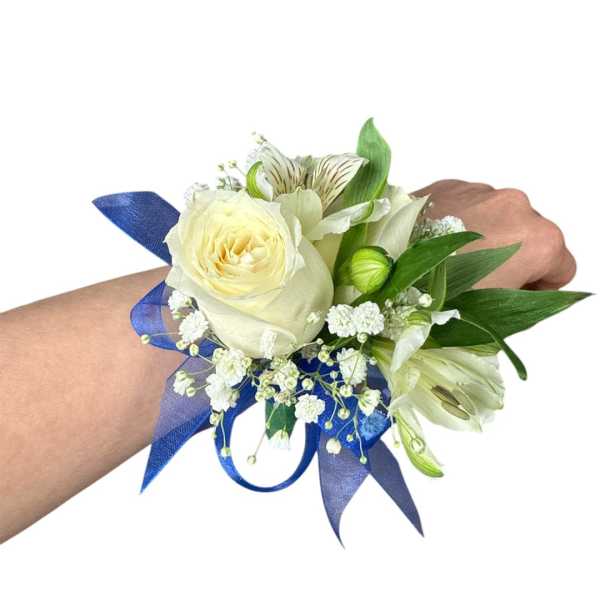 White rose wrist corsage with blue ribbon and small white flowers