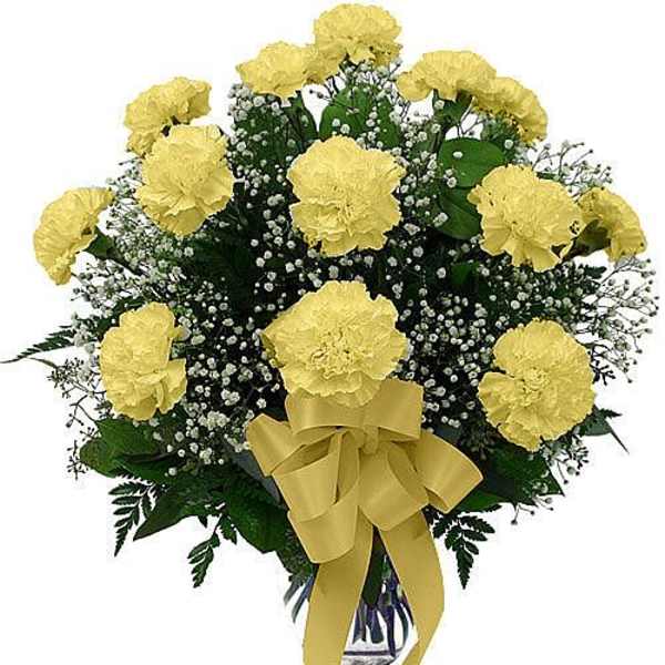 Yellow carnations with baby's breath in a vase, tied with a yellow ribbon