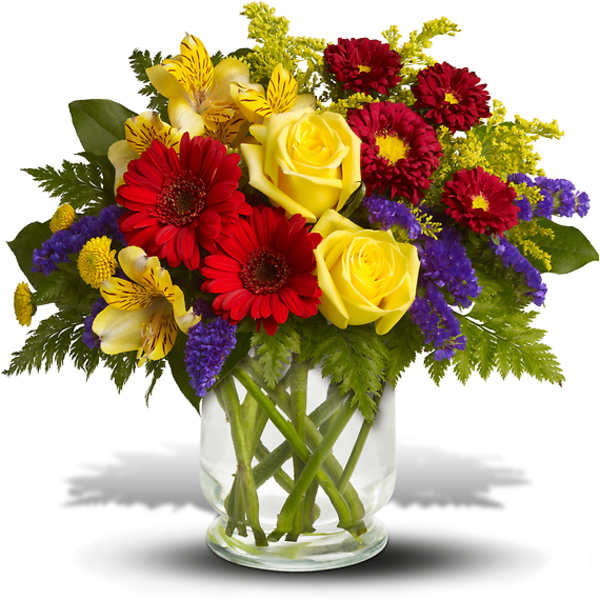 Bouquet of yellow roses, red daisies, and purple filler in a glass vase