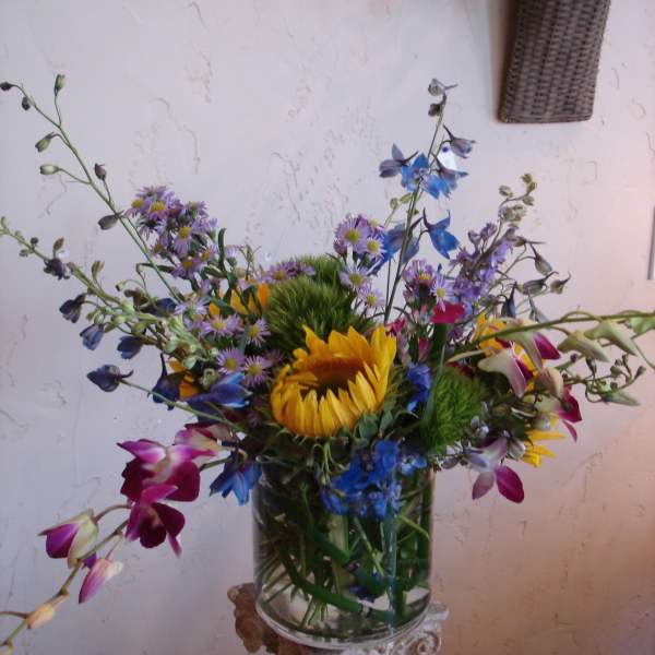 Colorful mixed bouquet in a clear glass vase