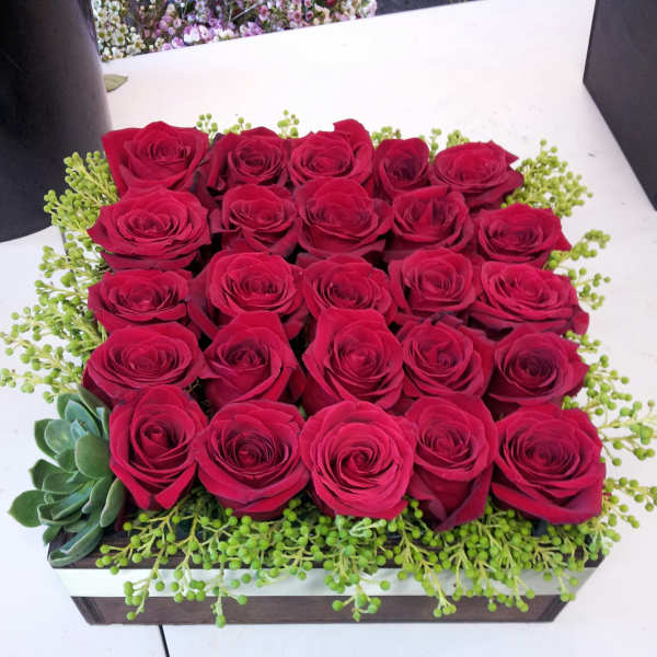Rectangular box arrangement of red roses with green filler