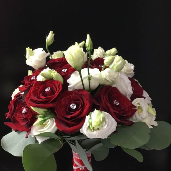 Bouquet of red and white roses with eucalyptus leaves