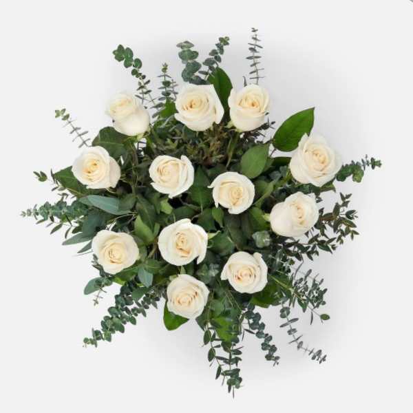 White rose bouquet with eucalyptus greenery on a white background