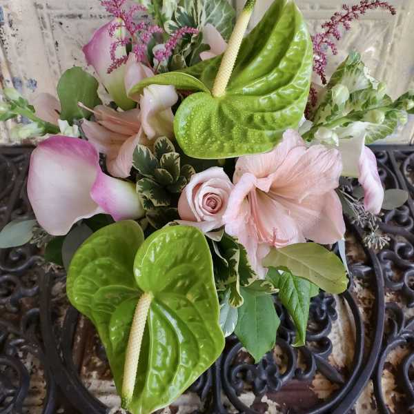 Pink and green bouquet with calla lilies, anthuriums, and roses