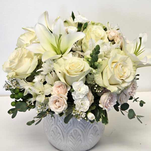 Beautiful flower arrangement purple and white breeze