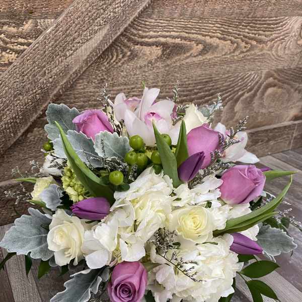 Bouquet of pink and white roses with hydrangeas and tulips