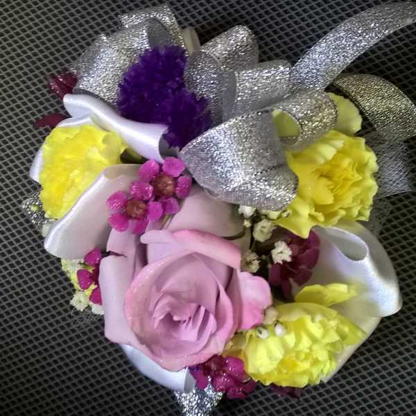 Small bouquet with pink and yellow flowers and silver ribbon