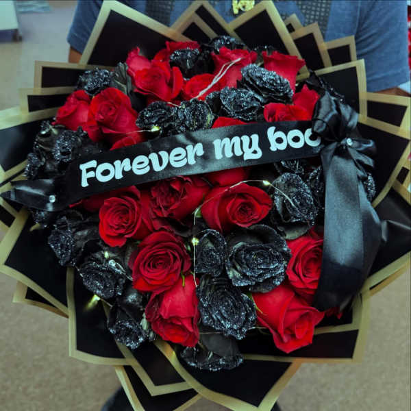 Bouquet of red roses with black glitter roses and a ribbon