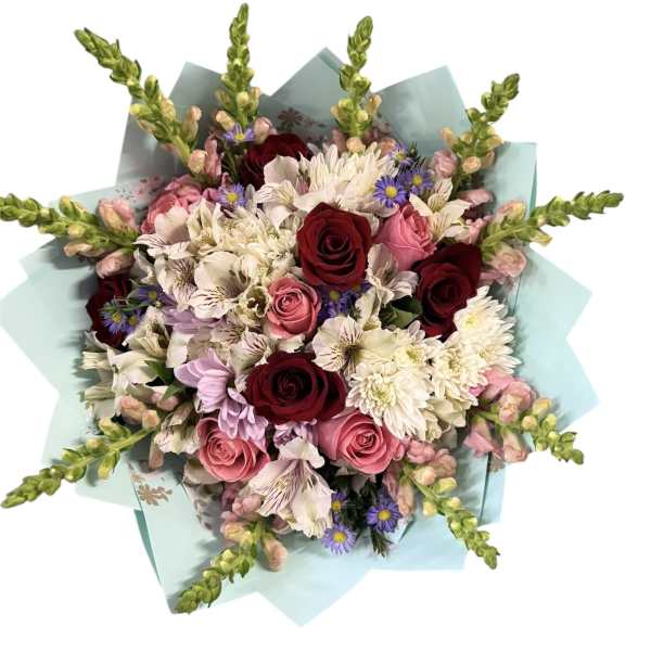 Bouquet of pink and burgundy roses with white daisies and purple accents