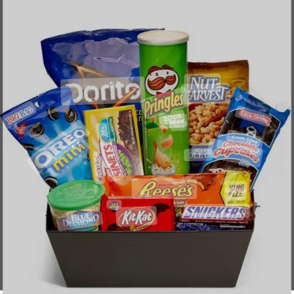 Gift basket filled with snack bags, candy bars, and a Pringles can