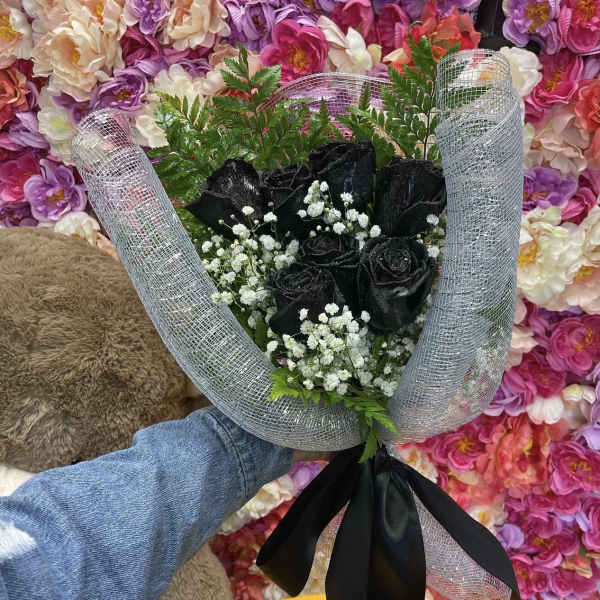 Bouquet of black roses with baby's breath in silver mesh wrap