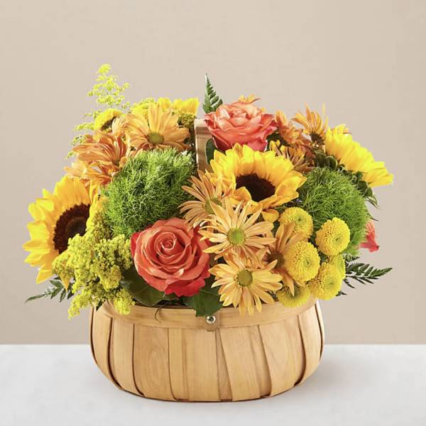 Basket arrangement with sunflowers, roses, and yellow mums
