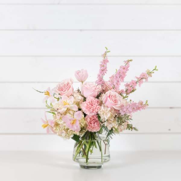 Pink and white mixed bouquet in a clear glass vase