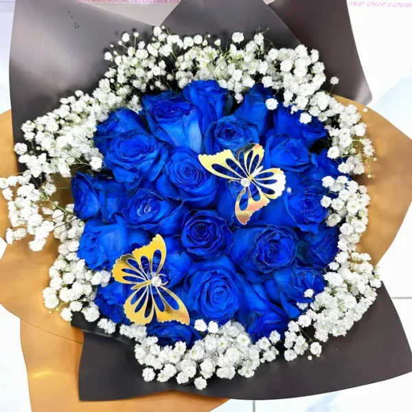 Bouquet of vivid blue roses with white baby's breath and butterfly accents