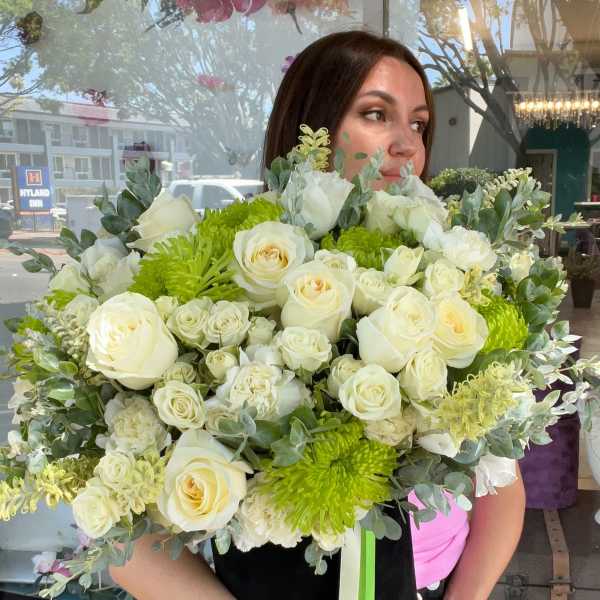 Large bouquet of white roses and green chrysanthemums with eucalyptus