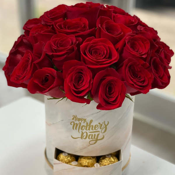 Red rose bouquet in a white box with chocolates