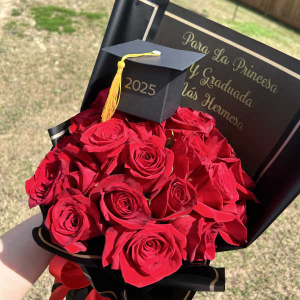 Bouquet of red roses with a graduation cap and card
