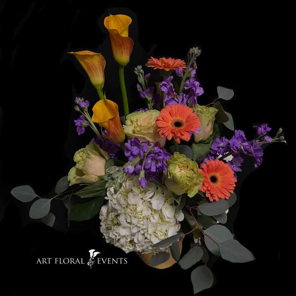 Bouquet with orange calla lilies, gerbera daisies, purple flowers, and white hydrangea