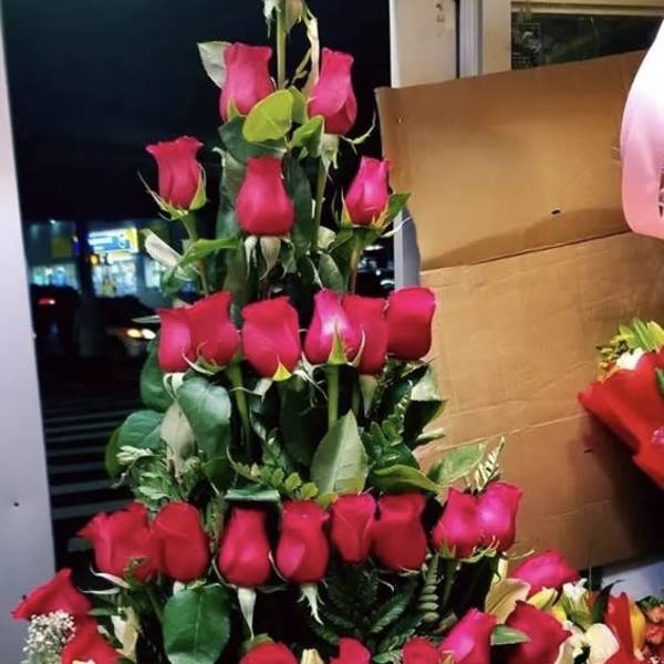 Tiered bouquet of red roses and white lilies