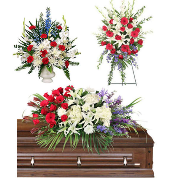 Floral casket spray with red, white, and purple flowers
