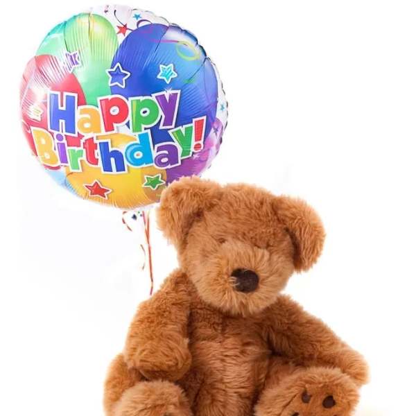 Teddy bear with a colorful Happy Birthday balloon
